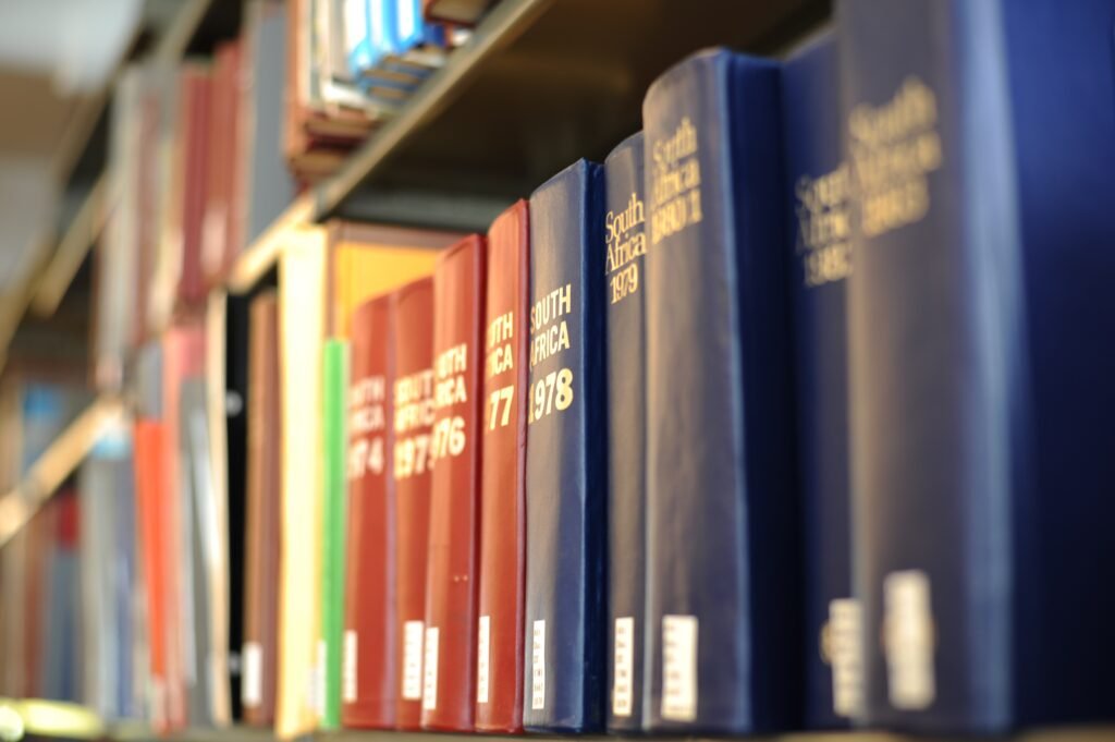 Densely shelved reference volumes photographed straight on, spines filling the frame.